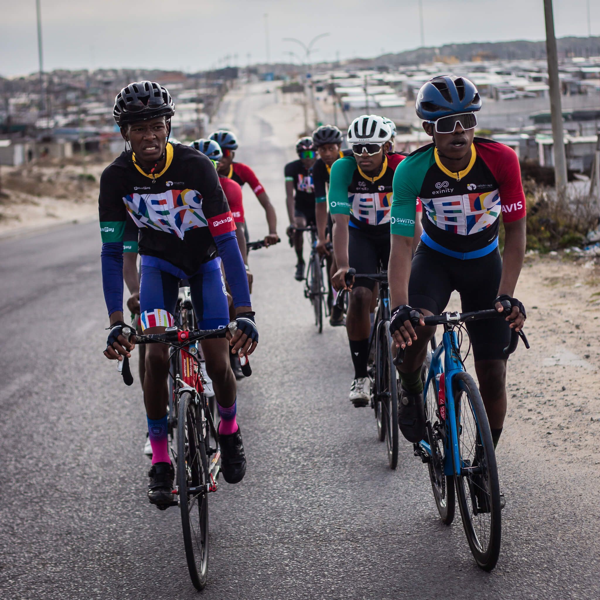 Velokhaya cyclists riding in formation through Khayelitsha